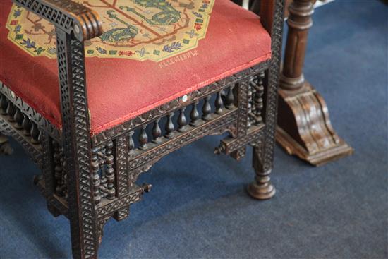 A late 19th century moorish open armchair and a similar armchair